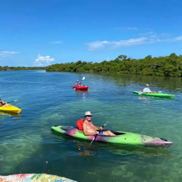 a group of people kayaking in key west