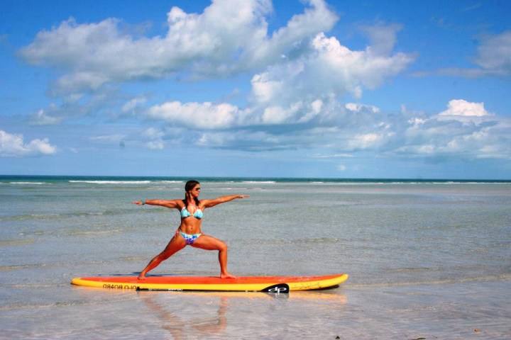 a person riding a surf board on a body of water